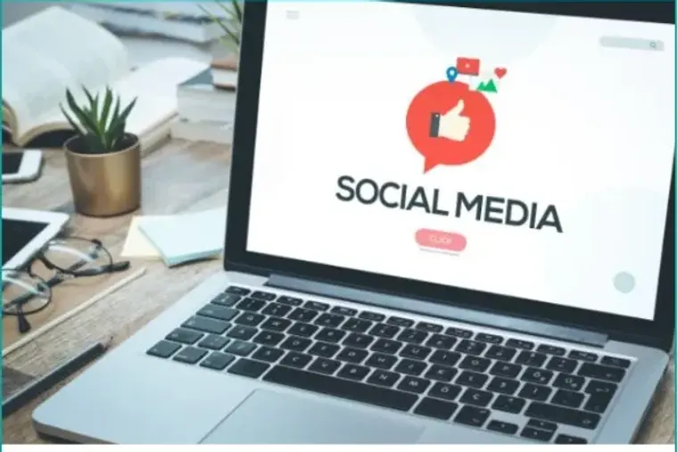 A laptop showing a social media dashboard